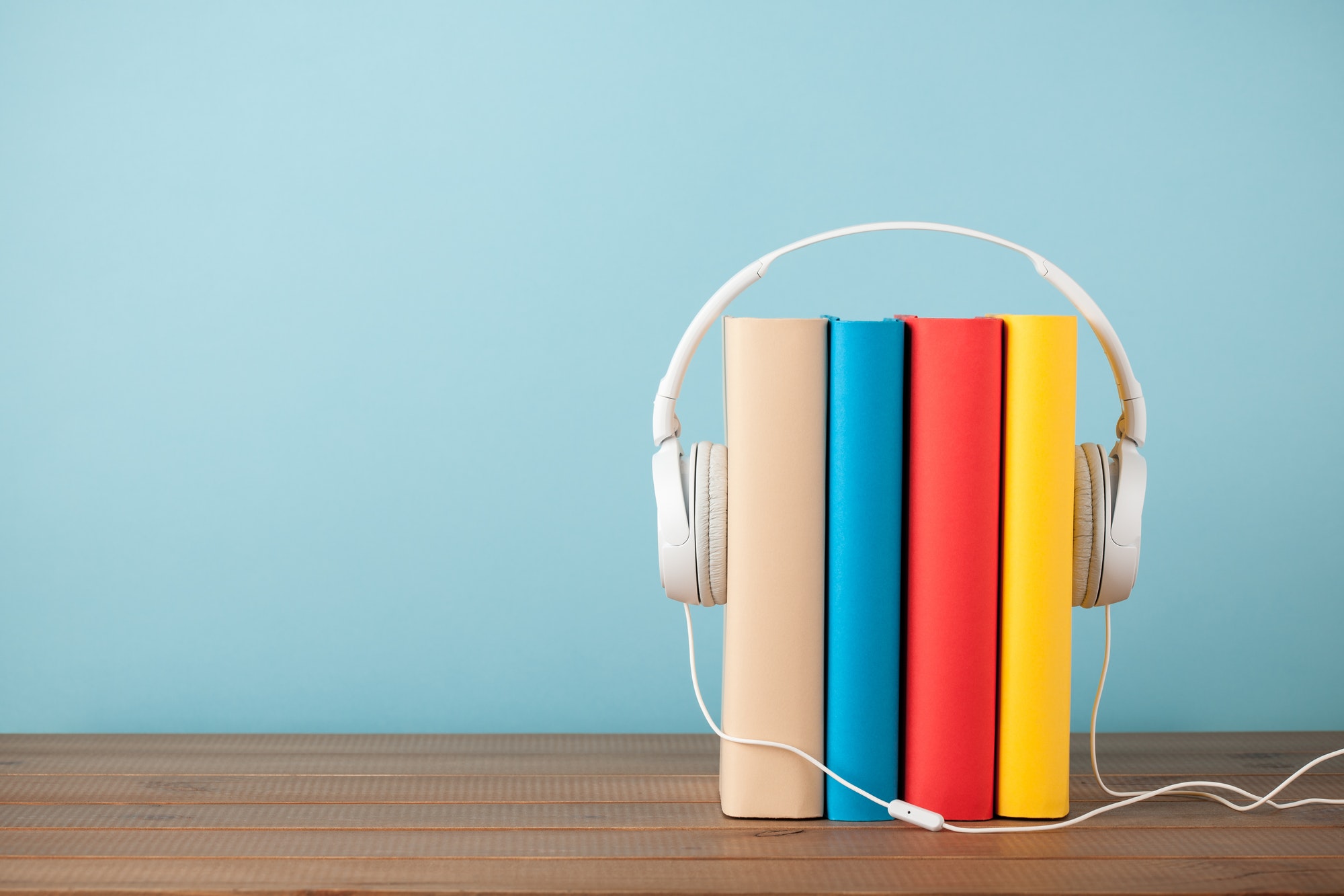 Stack of books with headphones