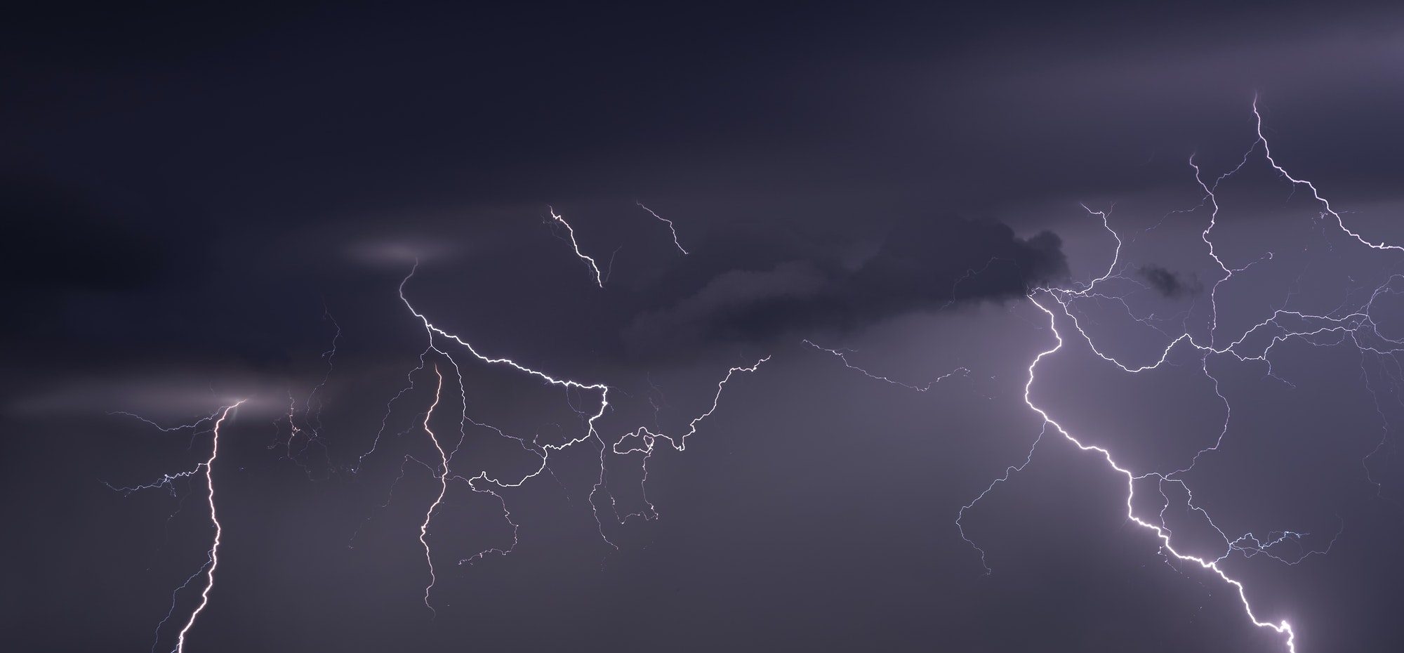 Large lightning strike at dusk on Tornado Alley