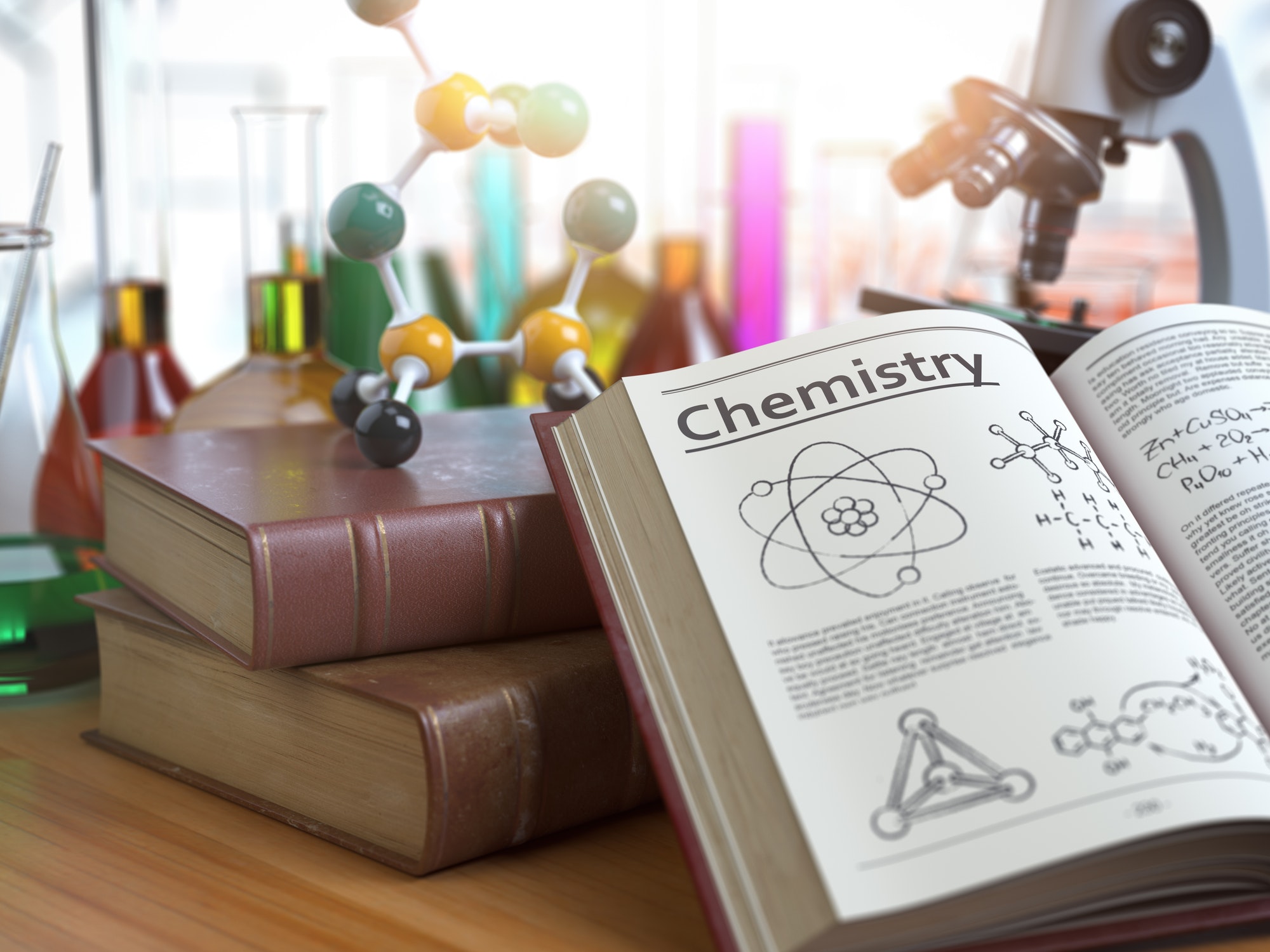 Chemistry education concept. Open books with text chemistry and