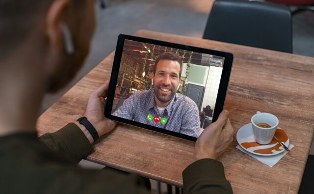 Man doing video call on tablet