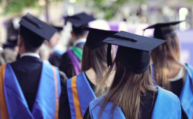 University graduates at graduation ceremony