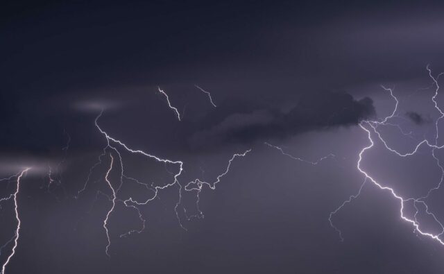 Large lightning strike at dusk on Tornado Alley